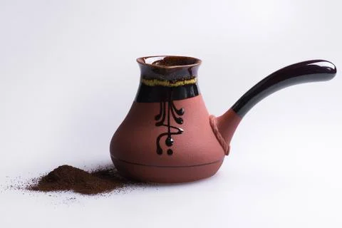 Ceramic turk for coffee lying on gray background. Stock Photos