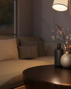 Ceramic vase with flower branches under lamp light on round wooden table an.. Stock Illustration