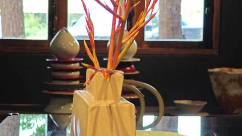 Ceramic vase with flower in showroom. 스톡 동영상 339989582