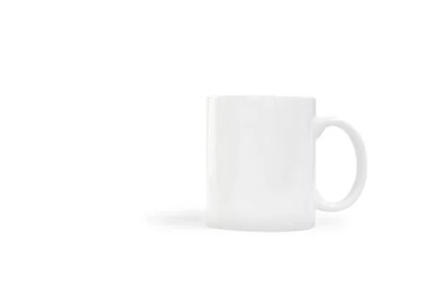 Ceramic white mug with clipping path on white background for mockup concept Fotos de archivo