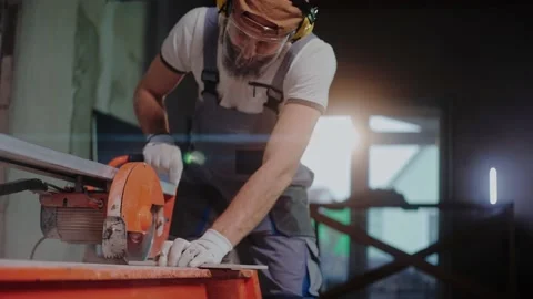 Ceramic worker uses electric tile cutter in construction studio Stock-Footage 170501208