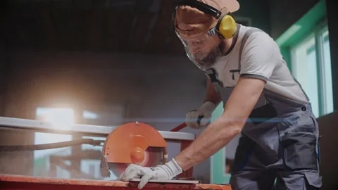 Ceramic worker using electric tile cutter in construction studio Stock Footage 170501359