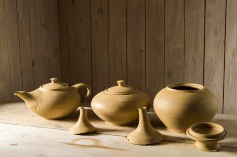 Ceramic workshop leather hard pots in three stages on workbench Pittenhart Stock Photos