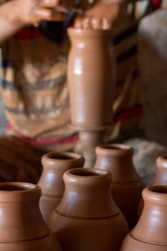 Ceramic workshop - the man  makes a pot of clay on a potter's wheel Stock Photos