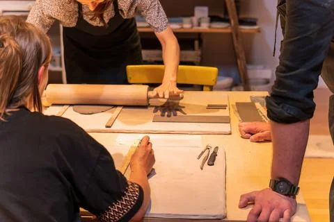 Ceramic Workshop Participants Engaging in Hands-On Pottery Techniques Stock Photos