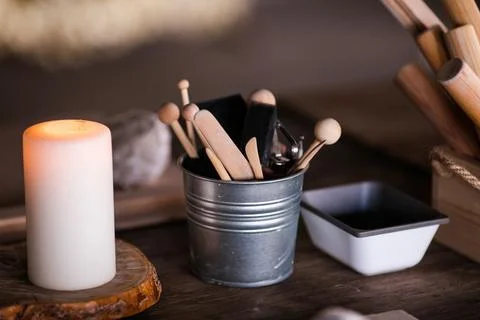 Ceramics. Objects for working with clay, stacks, sticks, brushes standing in  Stock Photos