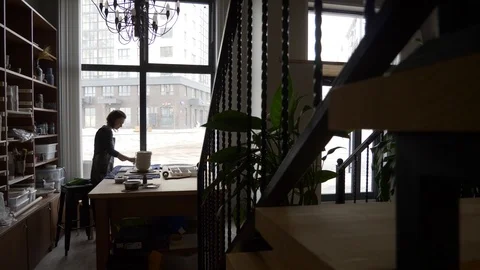 Ceramist creates a pattern and relief dolly shot Stock Footage 104871144