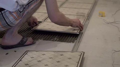 Ceramist puts tiles Stock Footage 74075927