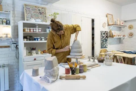 A ceramist's focus on clay Stock Photos