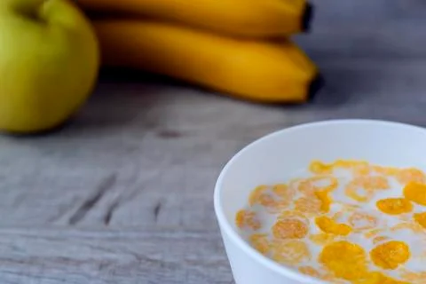 Cereal and fruit for Breakfast on the table. Delicious food at h Stock Photos