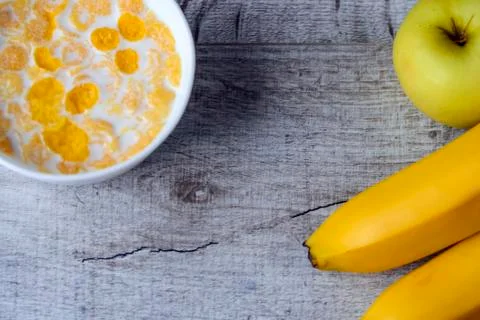 Cereal and fruit for Breakfast on the table. Delicious food at h Stock Photos