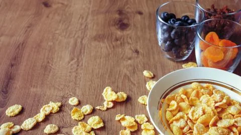 Cereal and fruit for Breakfast on the table. Delicious food at h Stock Photos