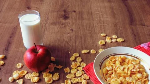 Cereal and fruit for Breakfast on the table. Delicious food at h Stock Photos
