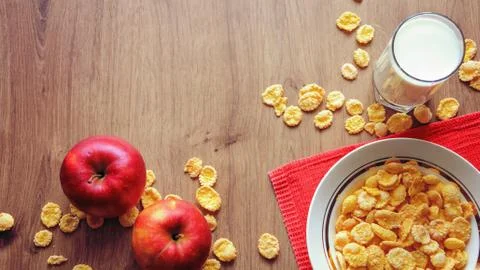 Cereal and fruit for Breakfast on the table. Delicious food at h Stock Photos