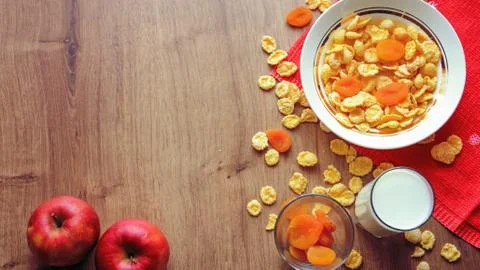 Cereal and fruit for Breakfast on the table. Delicious food at h Stock Photos