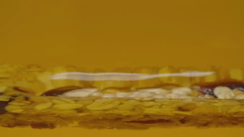 Cereal bar in the honey Stock Footage 176456531