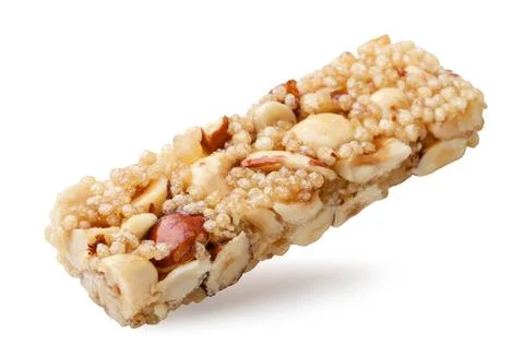 Cereal bar with nuts close up on a white. Isolated Stock Photos