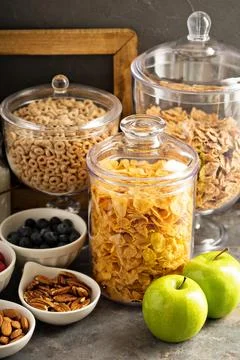Cereal bar or buffet wih cornflakes, fruit and nuts 스톡 사진