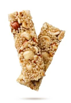 Cereal bars flying close-up on a white. Isolated Stock Photos