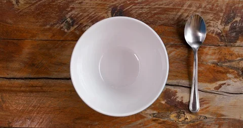 Cereal bowl with spoon Video stock 128229434