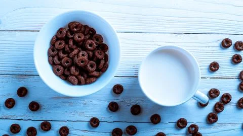 Cereal for Breakfast is on the table. Delicious rings from milk. Stock Photos
