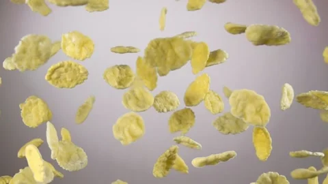Cereal corn flakes are flying up and rotating on the white background Stock Footage 145132087