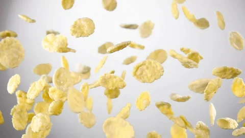 Cereal corn flakes are flying on the white background Stock Footage 312932948