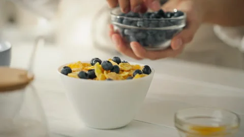 Cereal flakes with berries - the perfect diet breakfast. The video shows a c Stock Footage 282653828