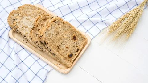 Cereal grains bread on a white table. Stock Photos