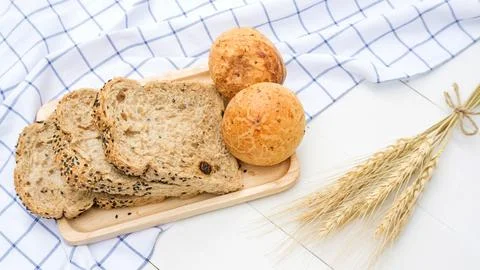 Cereal grains bread on a white table. Stock Photos