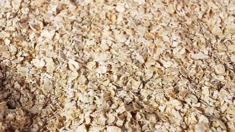 Cereal grains rotating pattern macro texture background backdrop footage video. Stock Footage 91379556