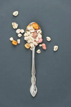 Cereal in a old spoon Stock Photos