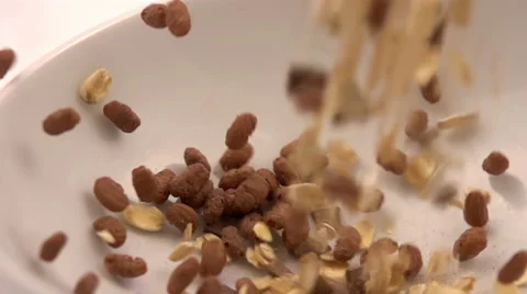 Cereals falling in bowl Stock Footage 63393443