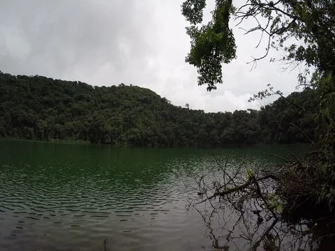Cerro Chato Volcano hike up to a dormant emerald green crater lake swimming h Video stock 80612891