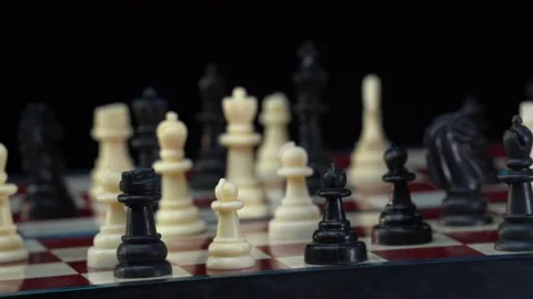 Cess board with figures on a black background, Rotating camera. Sport match Video stock 193071298