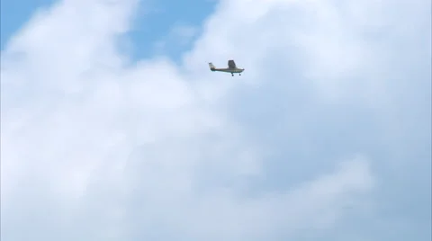 Cessna 172 Blue Sky Distant Fly By WS Stock Footage 67600589