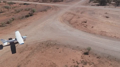Cessna 172 returning to hangar in outback Australia Stock Footage 92556815