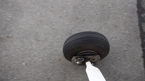 Cessna 172 wheel rolling along the runway Stock Footage 76561280