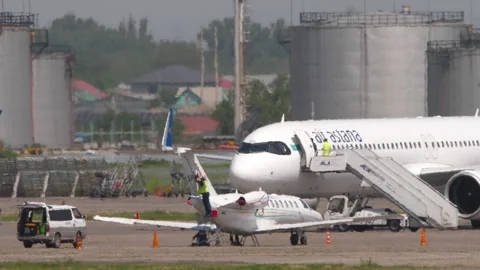 Cessna Citation CJ3 UP-CS301 and Air Astana A321neo EI-KGH parked at airport Stock Footage 341772455