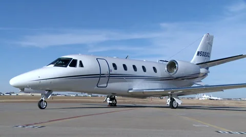 Cessna Citation XLS + Stat Zoom Out Stock Footage 68100559