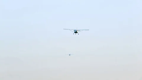 Cessna flies in the sky Stock Footage 80308905