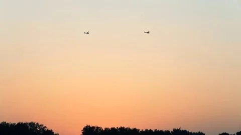 Cessna flies on the sunset Stock Footage 80312810