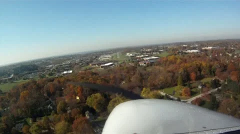 Cessna Landing with fall colors Stock Footage 12052431