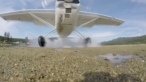 Cessna Making Gravel Bar Landing - Slow Motion Stock Footage