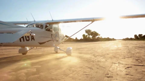 A Cessna-Type Single Engine Airplane taking off a farm airport Stock Footage 33702171