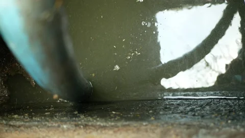 Cesspool pipe septic emptying pumping into tank by suction hose under high Stockbeeldmateriaal 147354040