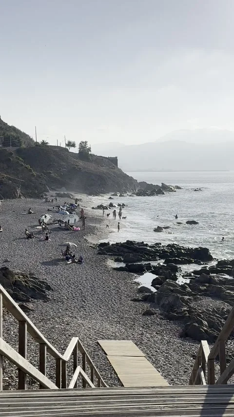 Ceuta evening at Playa de Santa Catalina with pets relaxed Stock Footage 333388946