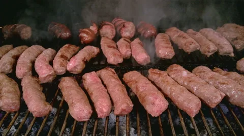 Cevapcici - A Sort Of Rolled Minced Meat Preparing on Grill Stock Footage 55801011