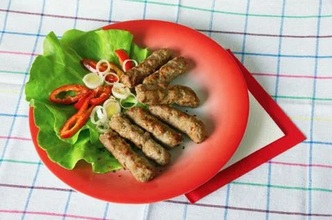 Cevapi - grilled dish of minced meat, popular in the Balkans Stock Photos