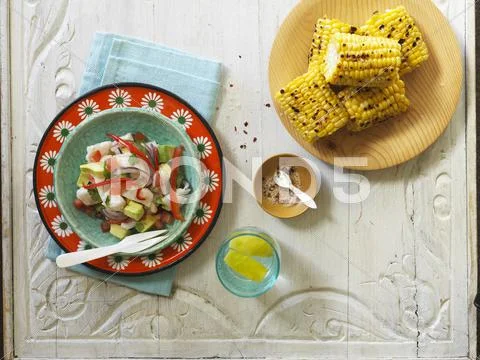 Ceviche aand grilled corn cobs (Latin America) Stock Photos